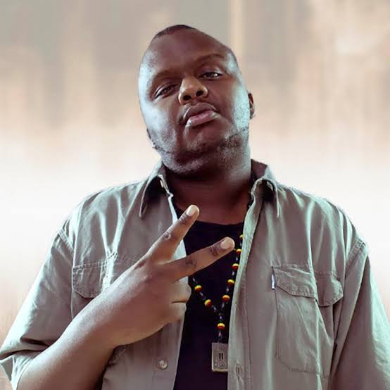 Mejja giving a peace sign, portrait